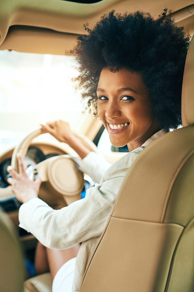 Happy woman driving